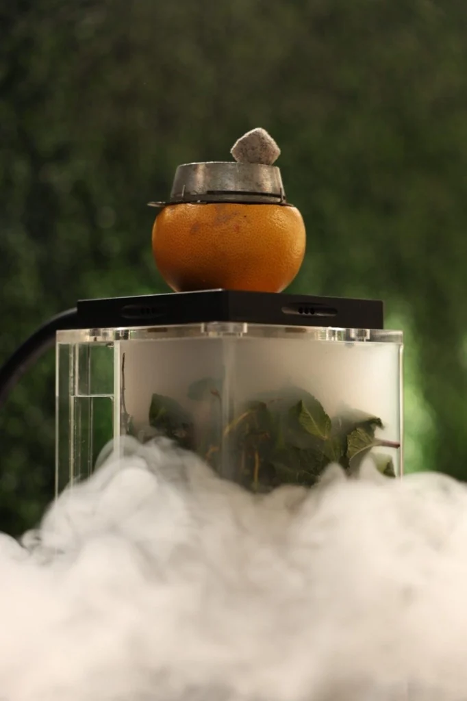 Orange fruit bowl and cube smoke