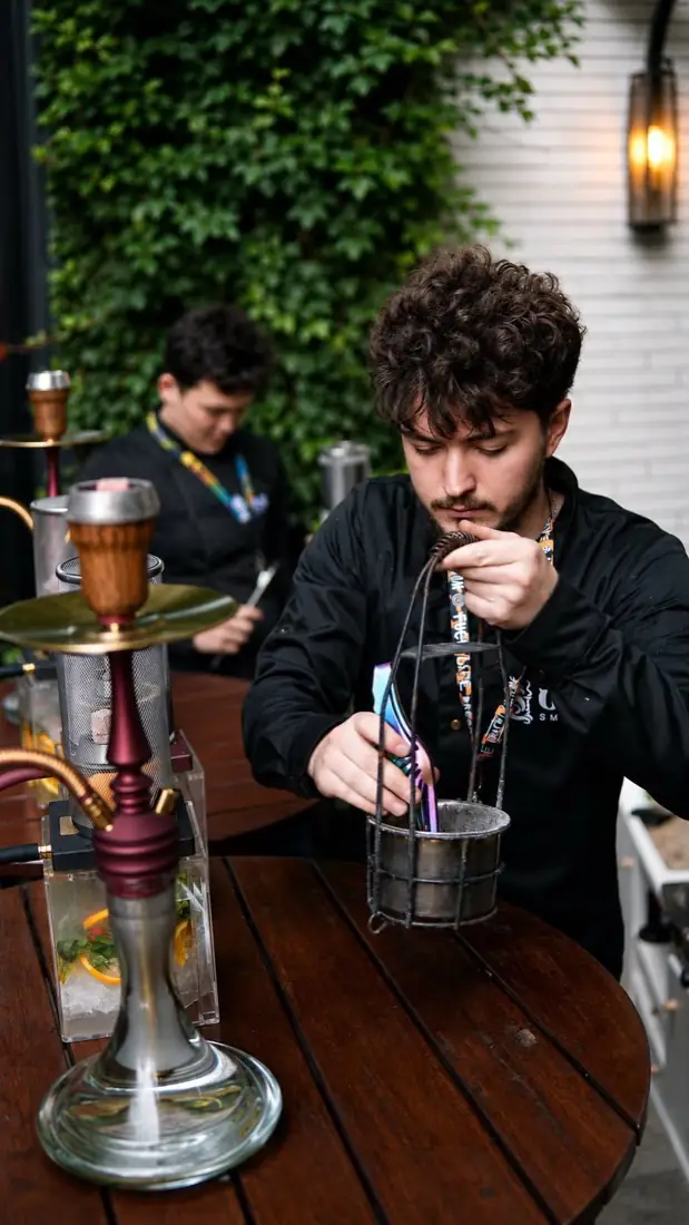 Staff preparing shisha on the City Road terrace